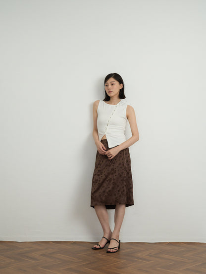asymmetric button top