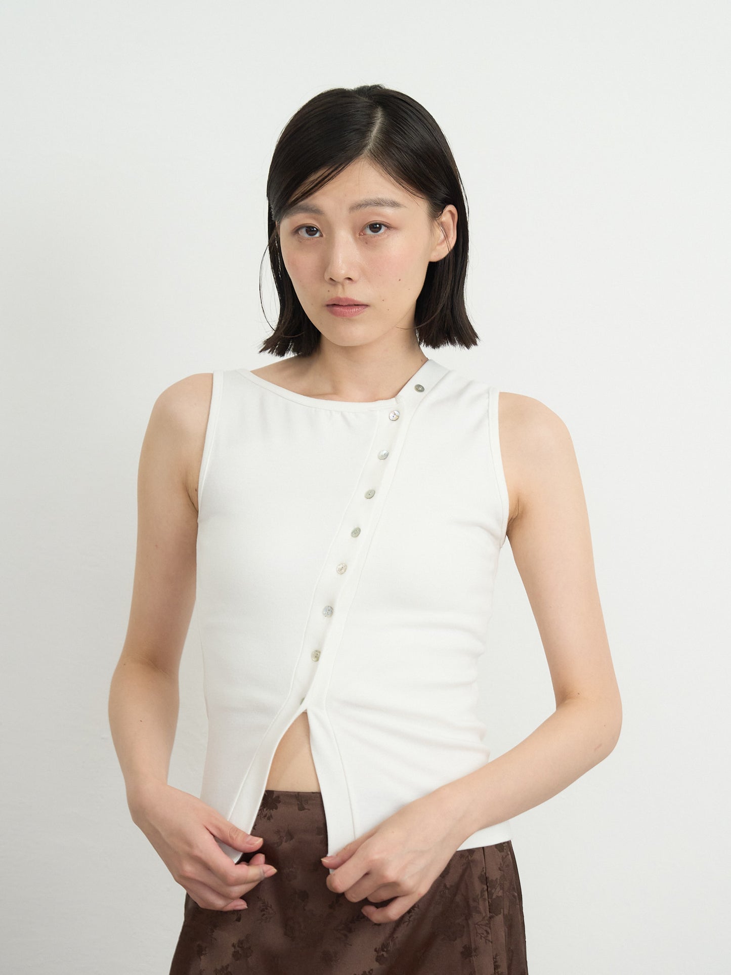 asymmetric button top