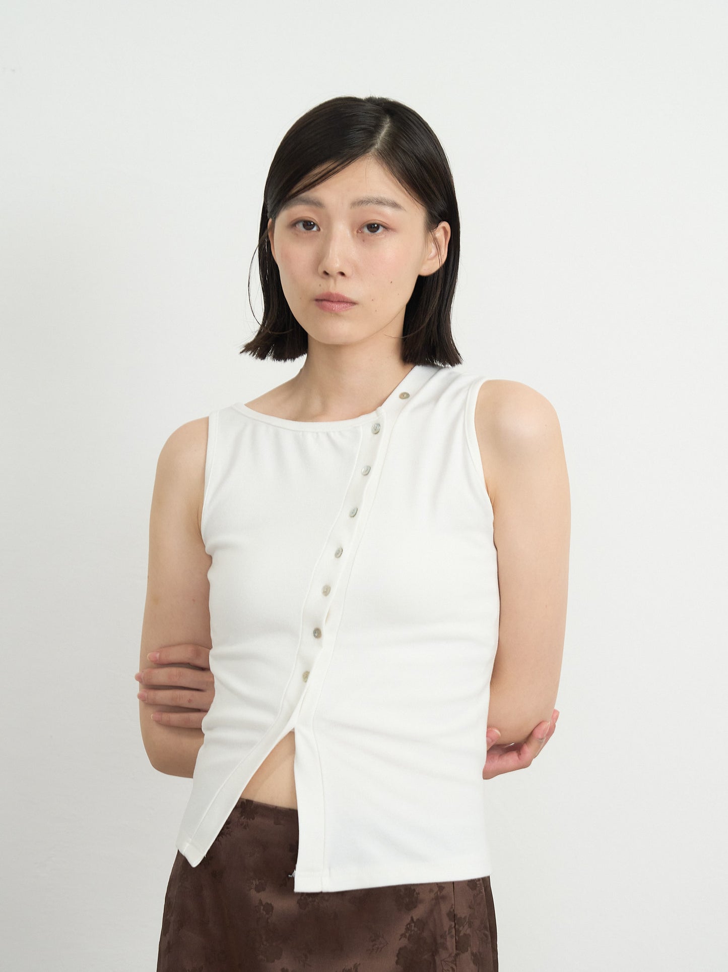 asymmetric button top