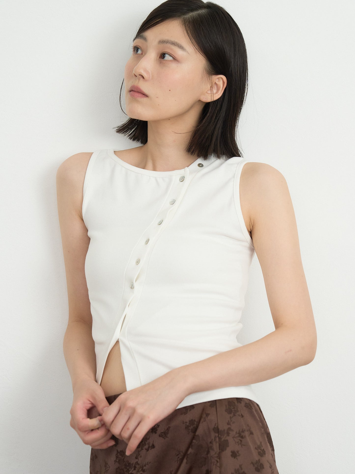 asymmetric button top