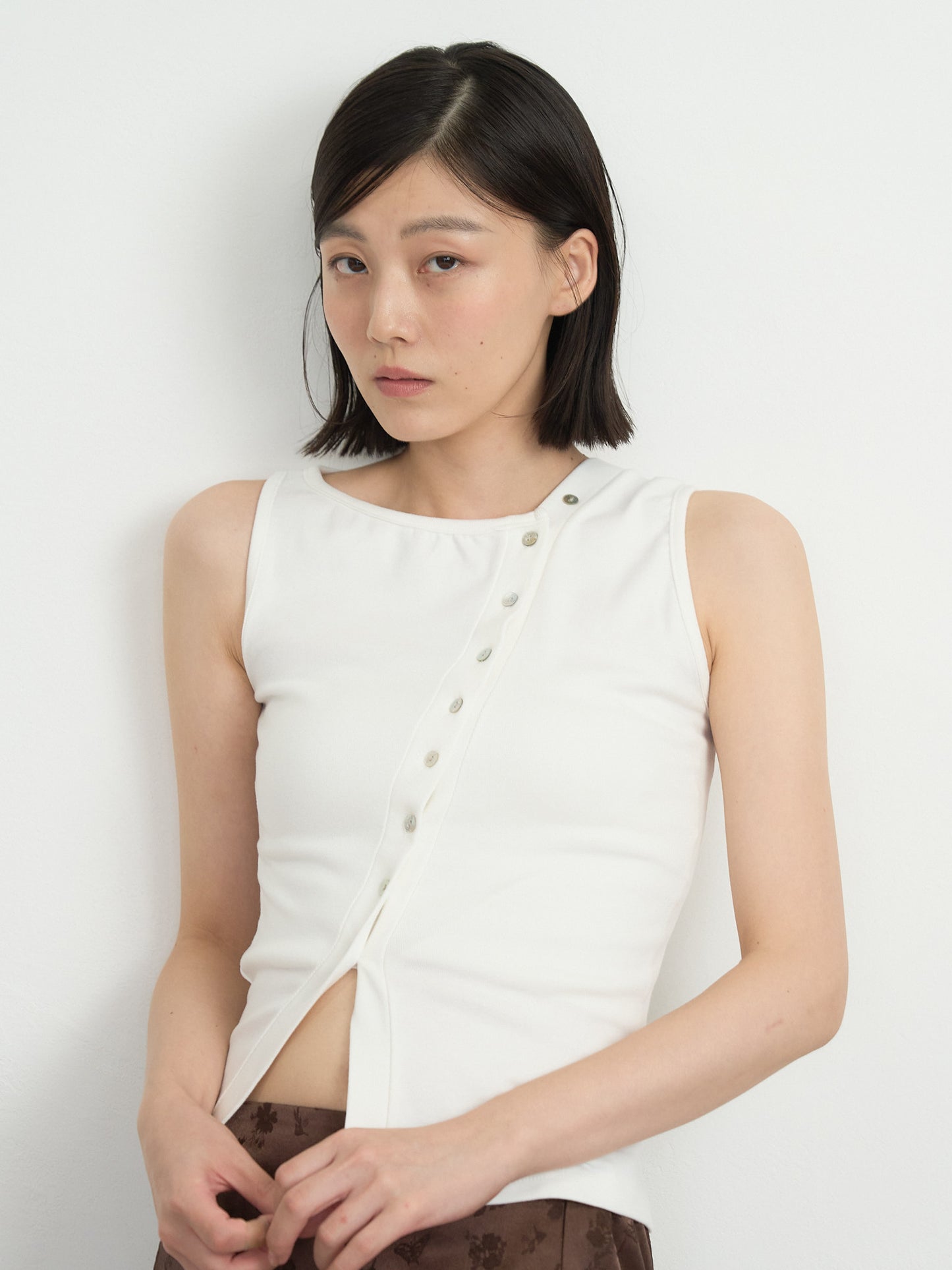 asymmetric button top