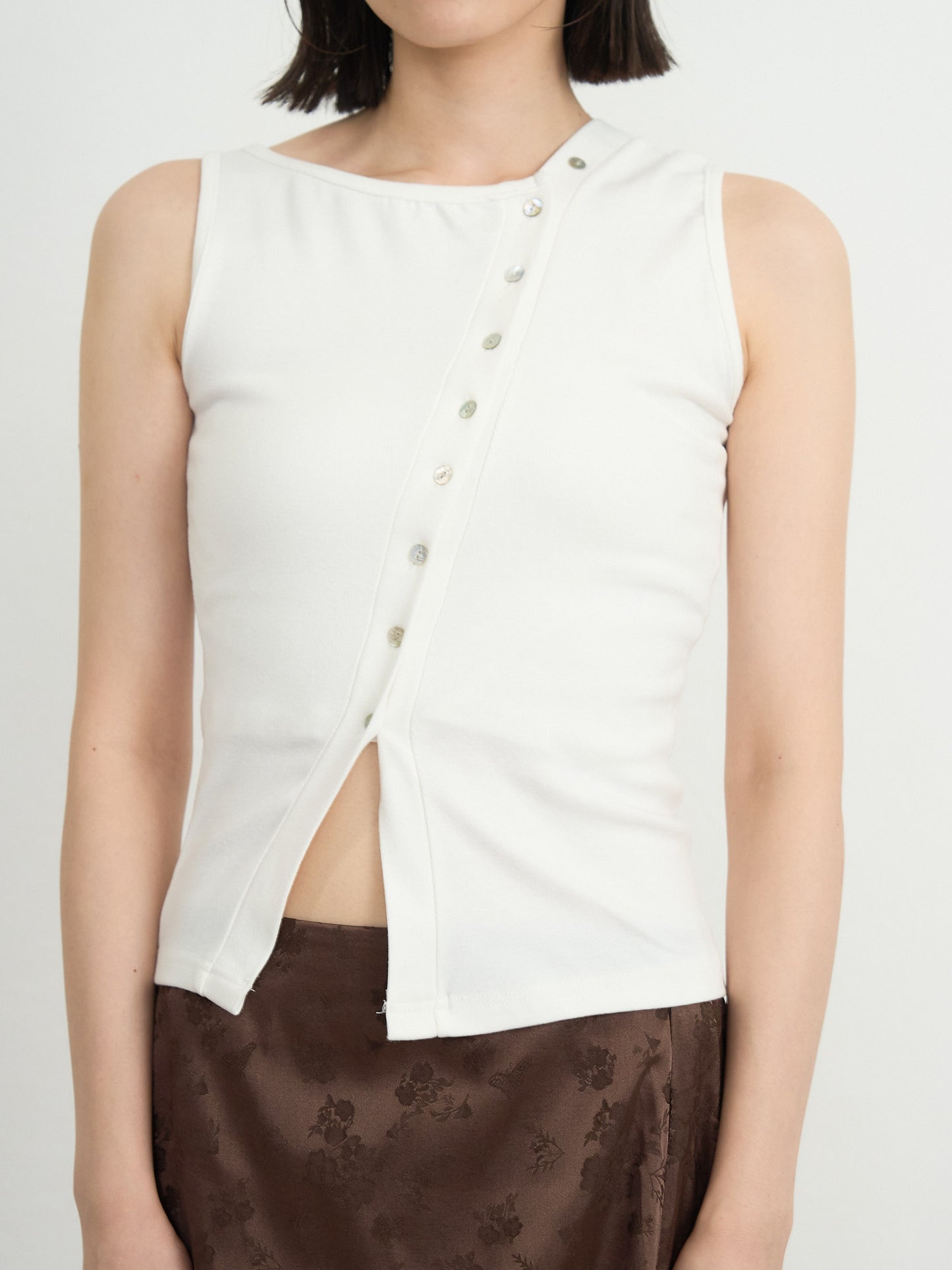 asymmetric button top