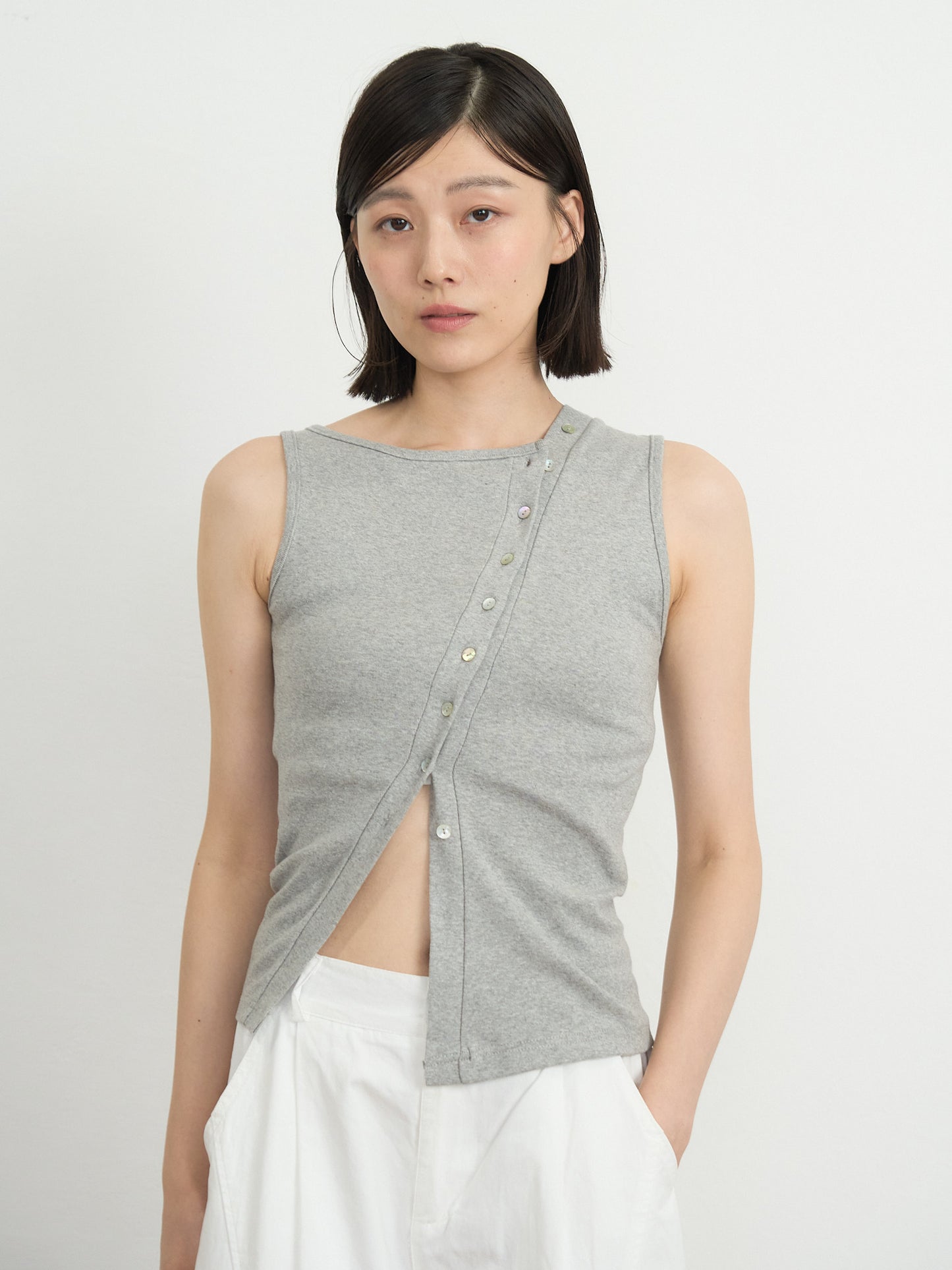 asymmetric button top