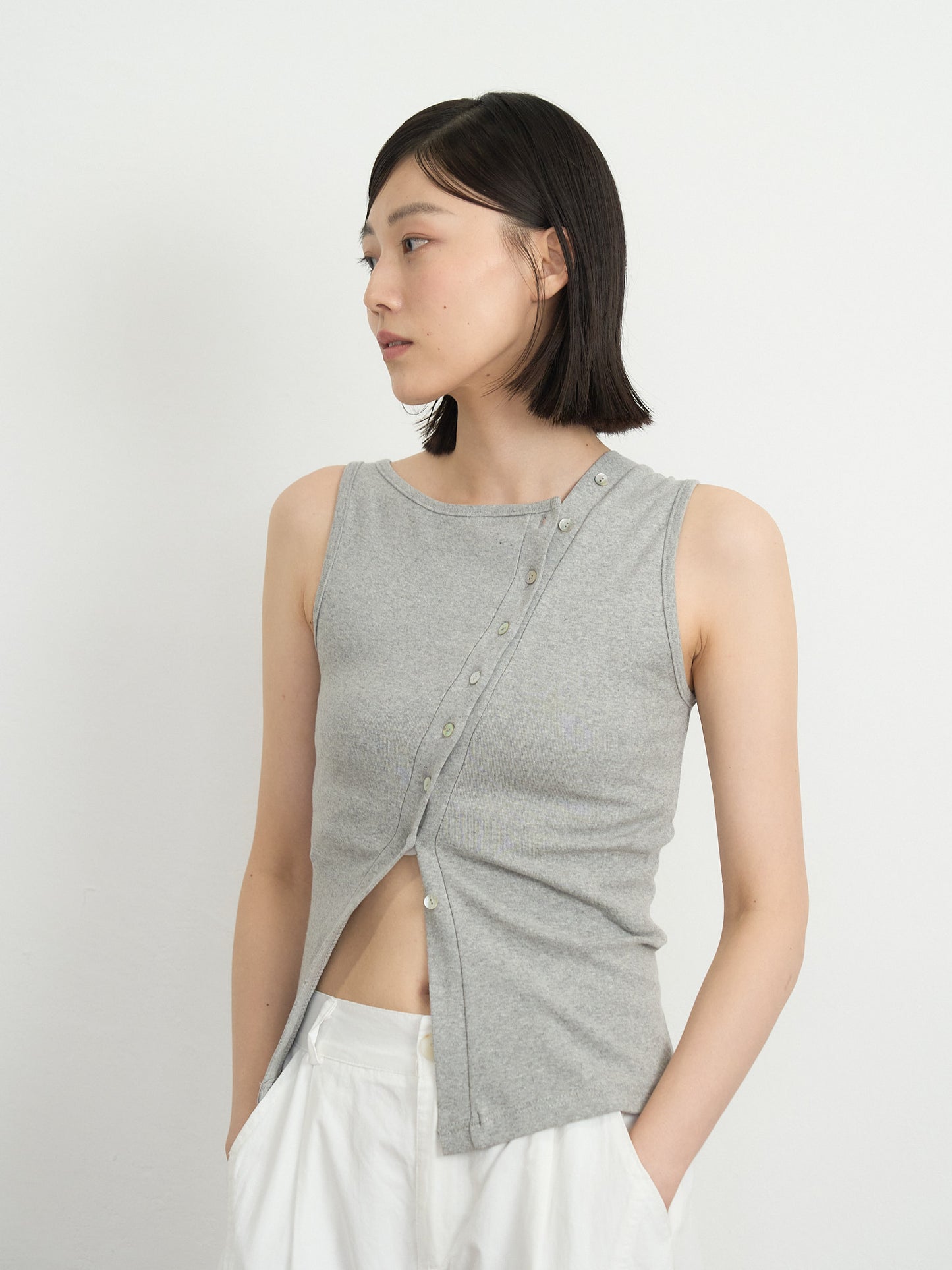 asymmetric button top