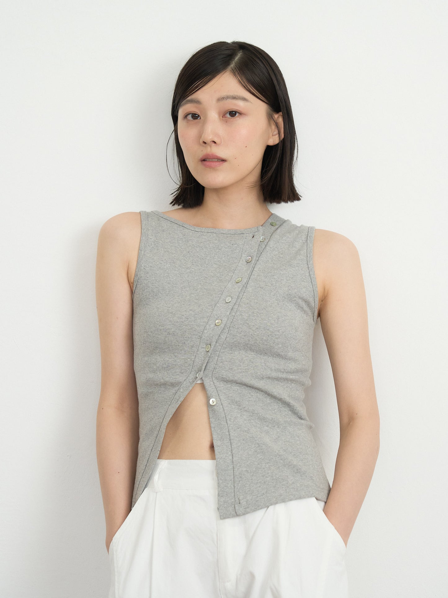 asymmetric button top